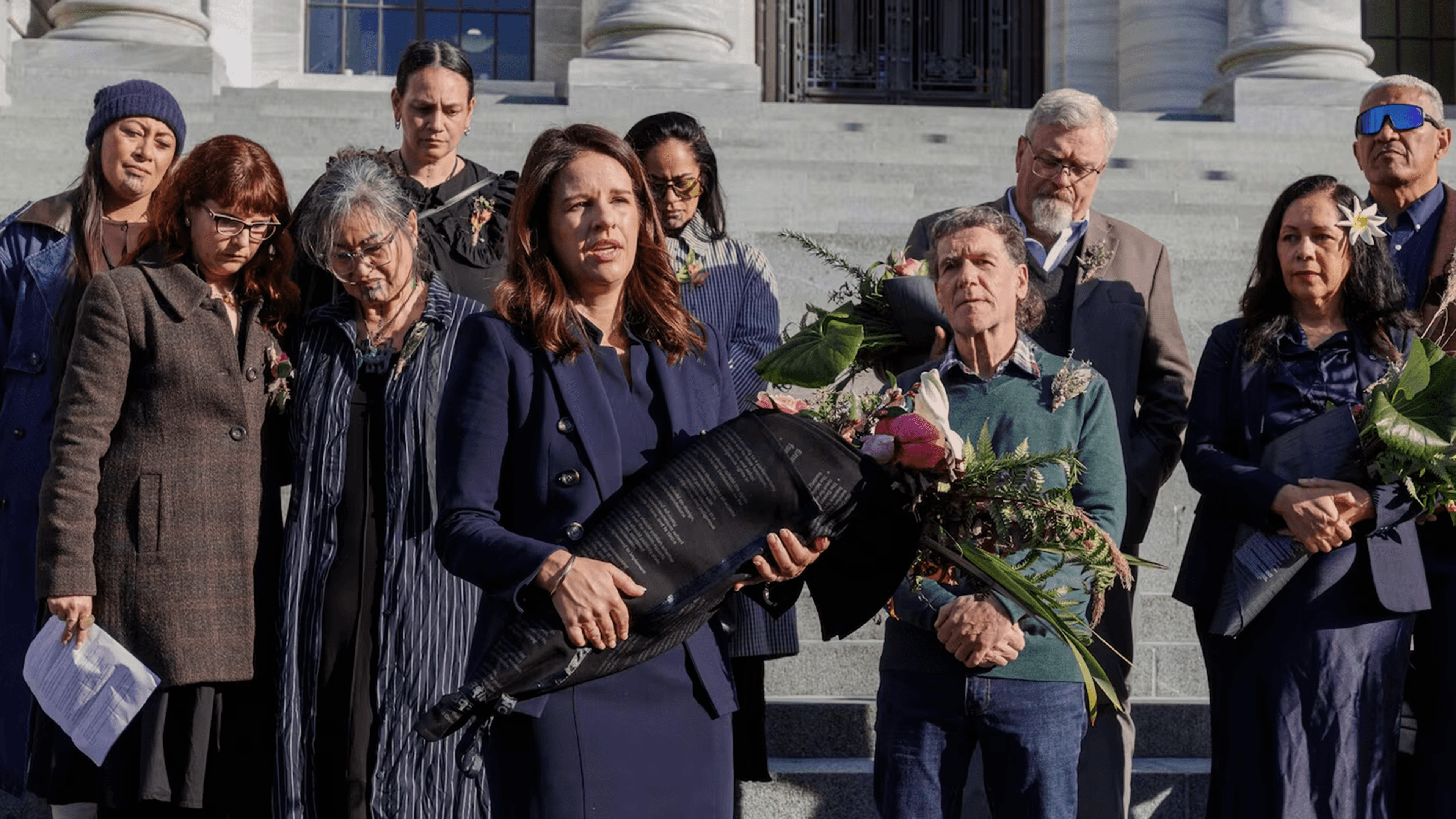 Erica Stanford holding a bouquet of flowers 